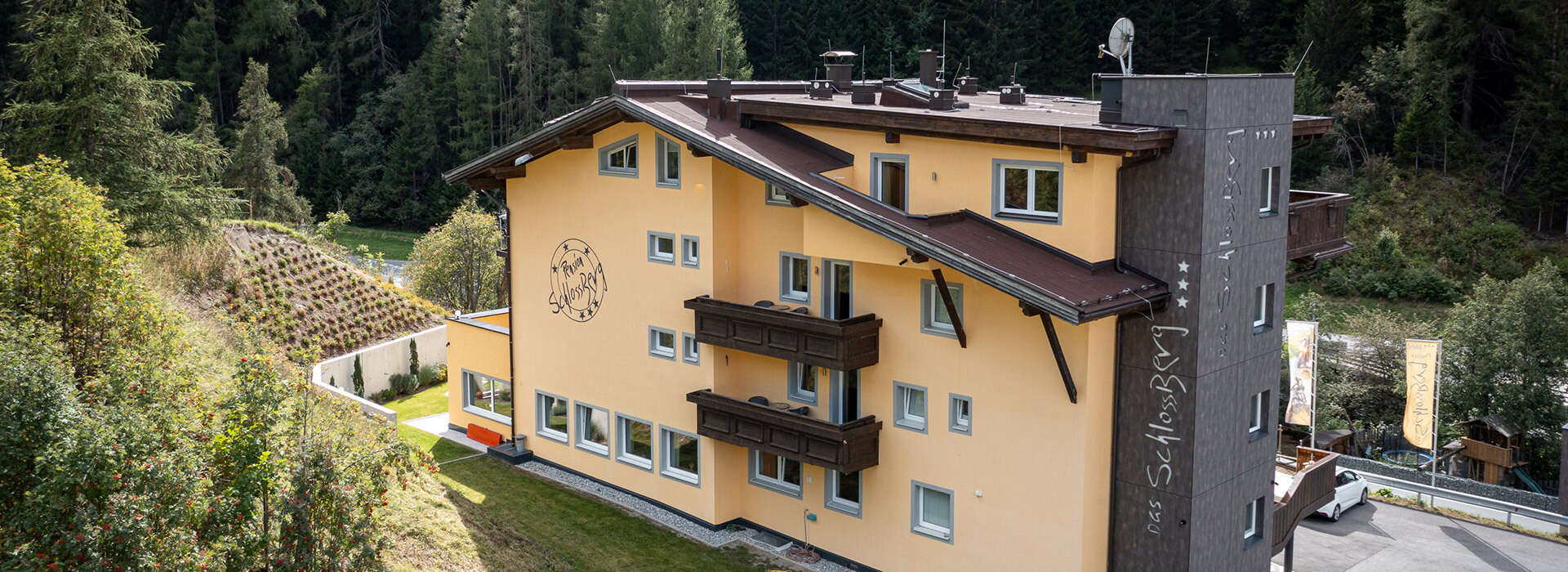 House view in summer from Das Schlossberg Hotel Nauders