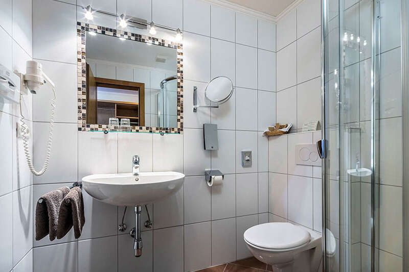 Bathroom and toilet in the room at Hotel Schlossberg in Nauders